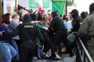 Belarusian law enforcement officers attempt to detain participants of an opposition rally protesting against police brutality and the presidential election results in Minsk. September 19, 2020.