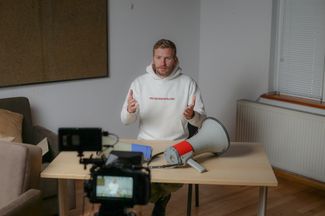 Anton Mikhalchuk, coordinator of the Free Russia Foundation, recording a training video for activists at his office in Tbilisi.