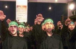 Hezbollah fighters pledge allegiance to the group. November 11, 2001