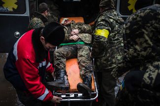 A Ukrainian soldier is transferred to the hospital after being wounded outside Debaltseve on February 2, 2015