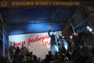 Now a well-known politician, blogger, and the founder of the “Rospil” project (which exposed corruption in government contracts), Navalny addresses a crowd of demonstrators at a protest against fraud in Russia’s 2011 parliamentary elections. Roughly 5,000 people joined a rally at Chistoprudny Boulevard on December 5, 2011. Several hundred people were arrested.