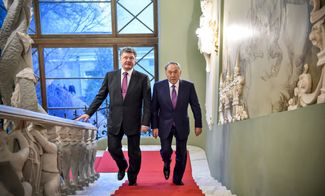 Nazarbayev with Ukrainian President Petro Poroshenko in Kyiv on December 22, 2014.