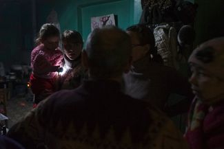 Local residents gather inside a bomb shelter in Debaltseve, January 30, 2015.