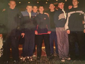 Vitaly Borodin with his trainer, Colonel Sergey Koveshnikov (center), and fellow cadets from the Higher Military Command Red Banner Chemical Defense School at the Tambov Regional Hand-to-Hand Combat Championship.