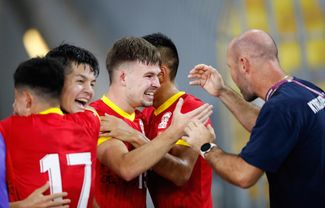 Kyrgyzstan’s players celebrate a goal during a 2026 World Cup qualifying game against Malaysia in Kuala Lumpur. November 16, 2023.
