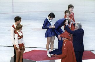 Irina Rodnina and Alexander Zaitsev receive their gold medals at the Winter Olympic Games in Lake Placid, New York. February 24, 1980.