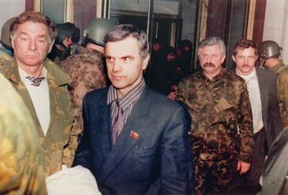 Khasbulatov and Rutskoy (in camouflage with a mustache) are taken out of the White House. October 4, 1993