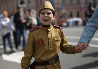 A child wearing a Soviet military uniform. Saint Petersburg, May 9, 2026