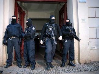 Police at one of the houses in Berlin after the raid. January 16, 2015