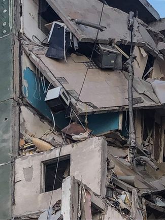 Разрушенные взрывом квартиры в доме на улице Черновола