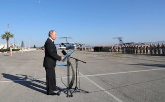 Vladimir Putin speaks to Russian soldiers at the Khmeimim airbase in Syria, December 11, 2017