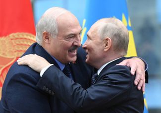 Vladimir Putin and Aleksandr Lukashenko greet each other during the Collective Security Treaty Organization summit in Minsk, Belarus. November 23, 2023.