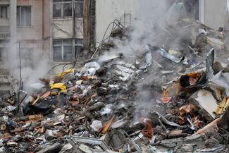 Rubble at the site of the destroyed residential building in Odesa