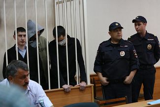 Former police officers of the police station “Dalniy” during the sentence reading. Kazan, June 16, 2014.