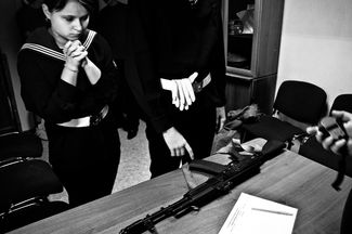 “Conscript’s Day” in a regional youth club as part of the military-patriotic education program. A timed competition of assembling and disassembling an assault rifle. St Petersburg, 2010.