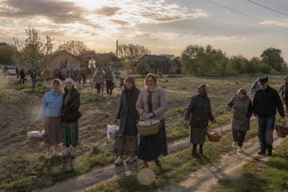 Locals carry Easter baskets in the village of Krasne in the Chernihiv region. Russian forces tried to capture the region at the start of the full-scale invasion but were forced to retreat. Russia has continued to target the Chernihiv region with drone and missile strikes ever since. 