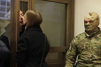 Ivan Safronov and his partner Ksenia Mironova in court on March 18, 2021