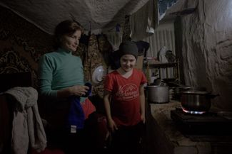 Oksana and Mykyta cook dinner