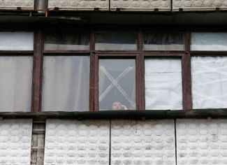 Windows taped in case of shelling, in separatist-controlled Horlivka in eastern Ukraine