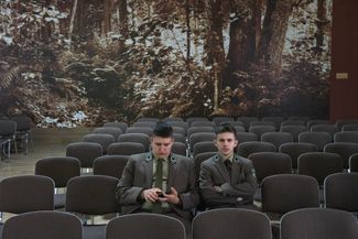 In a forestry school located in the village of Białowieża, two teenagers wait for the annual performance in the amphitheater. Most of these young people come from nearby villages. Many of them speak both Polish and Belarusian.