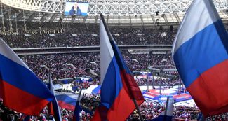 Акция на стадионе «Лужники» в Москве 18 марта 2022 года, в годовщину аннексии Крыма и на исходе первого месяца полномасштабного российского вторжения в Украину