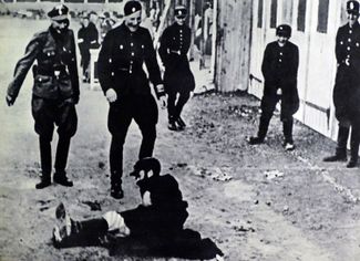 Nazi police and soldiers attack a Jewish man in Gdańsk after the German occupation of Poland in 1939