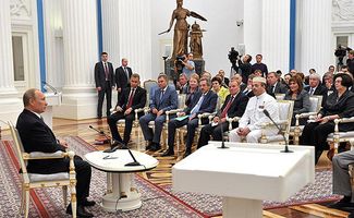 Vladimir Putin meets with regional human rights commissioners of the Russian Federation. (Nukhazhiev is on the right in the first row.)