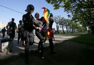 Police detain a participant at a rally on International Day Against Homophobia, Transphobia, and Biphobia in St. Petersburg on May 17, 2019
