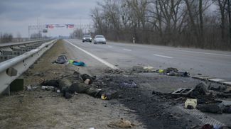A soldier’s body abandoned on the roadside near the town of Sytnyaky, outside Zhytomyr.