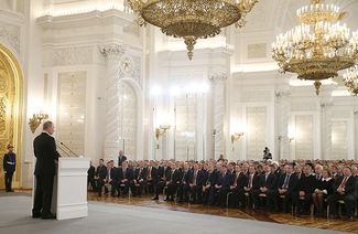 Владимир Путин выступает в Кремле перед депутатами Госдумы, членами Совета Федерации, руководителями регионов и общественниками в связи с обращением республики Крым и города Севастополь о приеме в состав России. 18 марта 2014 года