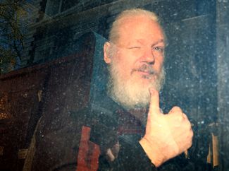 Wikileaks founder Julian Assange heads to court after his arrest in London. April 11, 2019.
