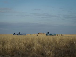Bluebird search and rescue vehicles gather in the steppe before a Soyuz MS-01 landing. Kazakhstan, October 2016