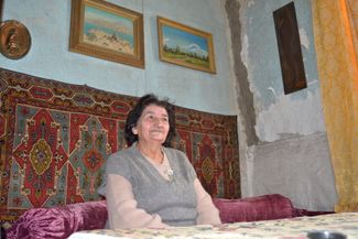 Kima Karapetyan, an Armenian history teacher, sits in her home just meters from the Margara border bridge. January 27, 2024.