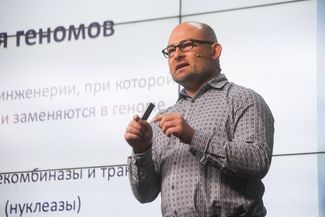 Denis Rebrikov delivers a lecture about gene editing in humans