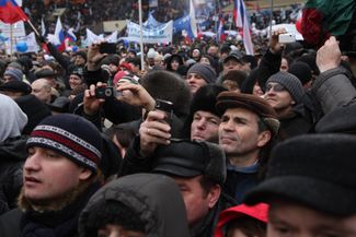 A crowd of Putin supporters — made up of Muscovites and those who were brought in on the many buses from the regions — gathered at Luzhniki Stadium. 