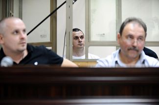 Lawyer Dmitry Dinze (left) and film director Oleg Sentsov (center)