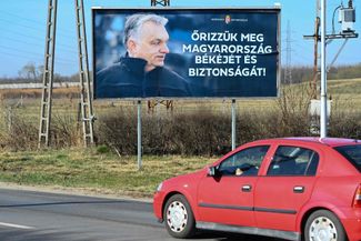 A 2022 Orbán billboard that reads “Let’s preserve Hungary’s peace and security!”