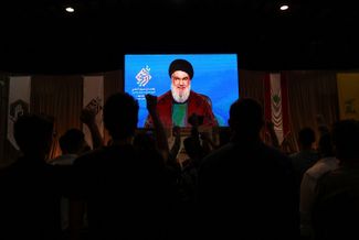 Лидер «Хезболлы» Хасан Насралла выступает по видеосвязи на митинге в южном пригороде Бейрута. 11 ноября 2022 года 