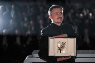 Christian Mungiu with the Palme d'Or. May 23, 2026