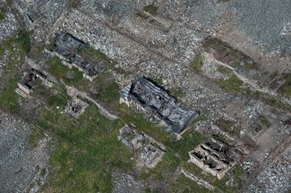 Detached camp station “Sopka,” a destroyed barracks, and administrative buildings