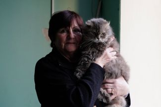 One of the shelter’s residents, Zinaida, and her cat Masyanya. They fled Lyman together after Zinaida’s house was destroyed. 