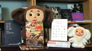 Two Cheburashka dolls watch over books written by members of the Cheburashka Collective. Philadelphia, April 28, 2019