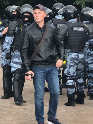 A man carries a video camera at Moscow’s August 3 protest.