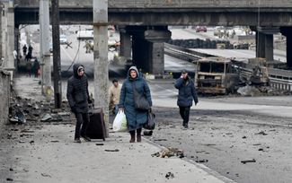 Civilians flee Kyiv.