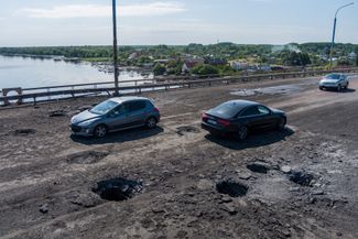 A bridge linking Kherson to the Dnipro’s left bank after Ukrainian strikes launched on July 19 and July 20, 2022