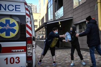An ambulance delivers water to a children’s hospital in Kyiv