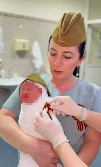 In maternity hospitals in North Ossetia, babies were put on hats – and St. George ribbons were tied to them