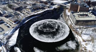 A naturally occurring ice disk forms on the Presumpscot River in Westbrook, Maine. Scientists <a href="https://journals.aps.org/pre/abstract/10.1103/PhysRevE.93.033112" target="_blank">say</a> these disks spin in the water because melting generates a vortex that induces the rotation of a floating object. January 14, 2019.