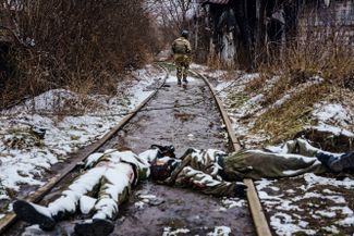 Bodies of dead Russian soldiers, after fighting near the railroad on the outskirts of Irpin in the Kyiv region