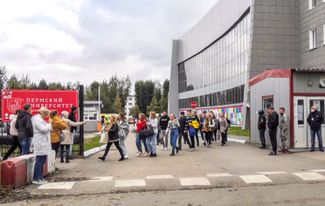 Students being evacuated from the Perm State University campus